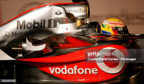 Lewis Hamilton drives his Vodafone McLaren Mercedes around the streets of Valencia during it's launch in L'Hemisferic, Ciudad de las Artes y de las...