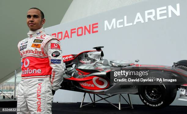 Vodafone McLaren Mercedes driver Lewis Hamilton of Great Britain poses with the new McLaren MP4-22 Formula One car during the launch in L'Hemisferic,...