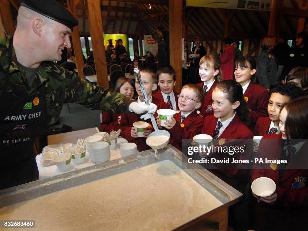 Pupils from Crackley Hall School in Kenilworth line up for their share of the World Record amount of porridge cooked up by Pt. James St Clair-Jones...