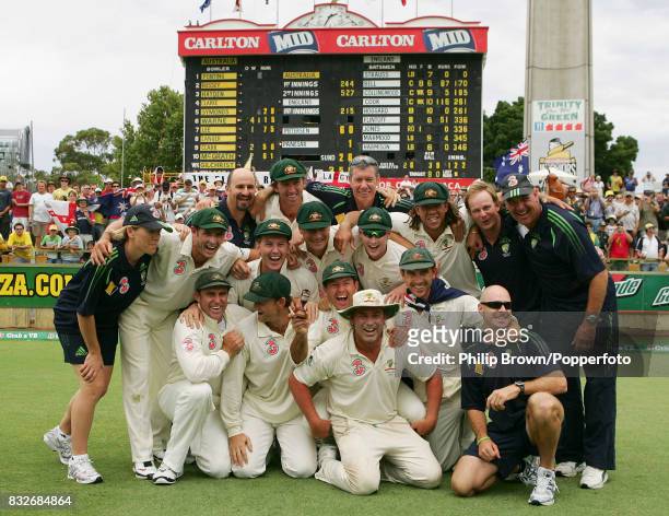 The Australian players and coaching staff celebrate with a replica Ashes urn after winning the 3rd Test match between Australia and England by 206...