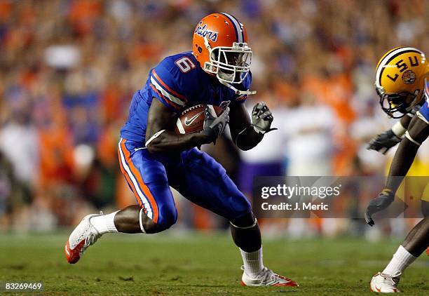 Receiver Deonte Thompson of the Florida Gators runs for additional yardage after a catch against the LSU Tigers during the game on October 11, 2008...