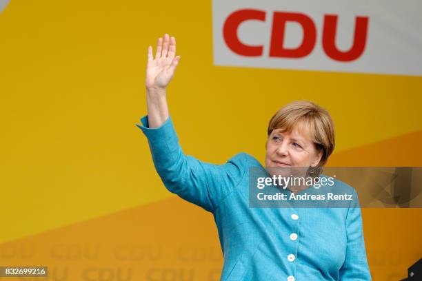 German Chancellor and head of the German Christian Democrats Angela Merkel greets supporters after an election rally at the headland known as the...