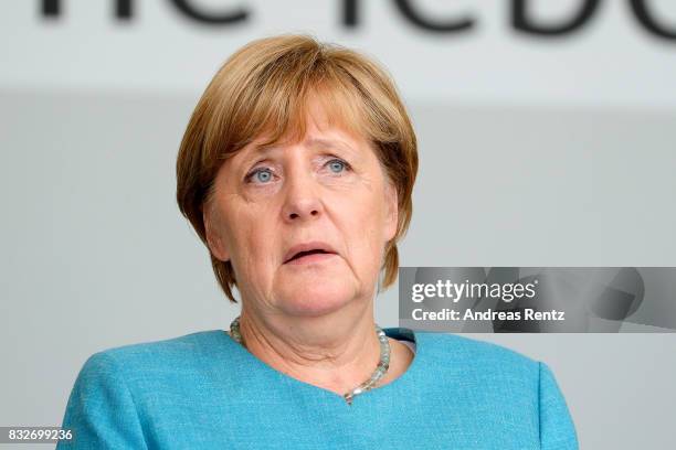 German Chancellor and head of the German Christian Democrats Angela Merkel is seen on stage at an election rally at the headland known as the...