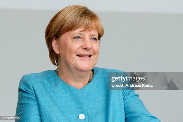 German Chancellor and head of the German Christian Democrats Angela Merkel is seen on stage at an election rally at the headland known as the...