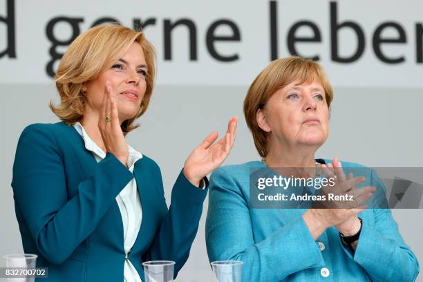 Chairman of CDU Rheinland-Pfalz Julia Kloeckner and German Chancellor and head of the German Christian Democrats Angela Merkel are seen on stage at...