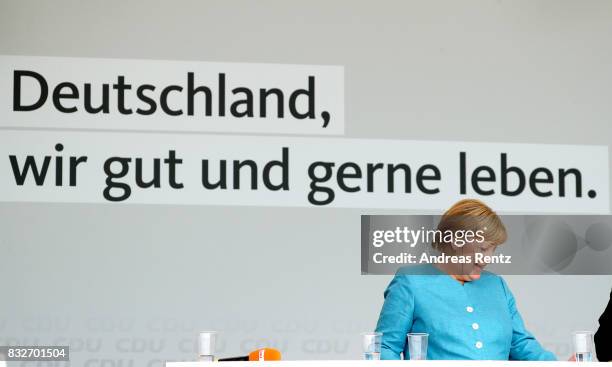 German Chancellor and head of the German Christian Democrats Angela Merkel is seen on stage at an election rally at the headland known as the...