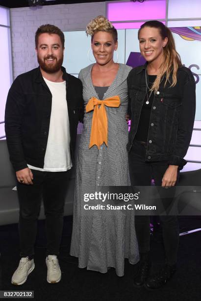 Pink poses with presenters Tom Green and Charlie Tee as she visits the Kiss FM Studios on August 16, 2017 in London, England.