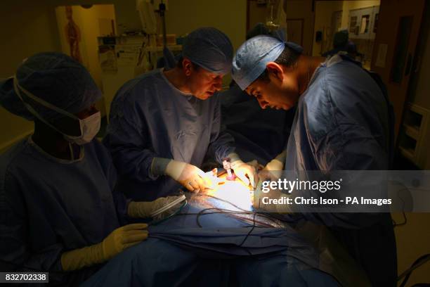 Consultant Surgeon Andrew Miles and Registrar Jim Khan perform a Laparoscopic Anterior Resection on a patient at the Royal Hampshire County Hospital...