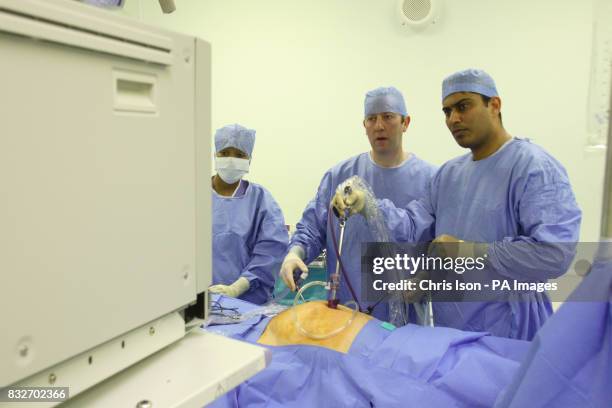 Consultant Surgeon Andrew Miles and Registrar Jim Khan perform a Laparoscopic Anterior Resection on a patient at the Royal Hampshire County Hospital...