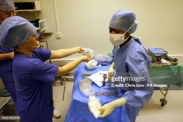 Operating Theatre staff prepare for a Laparoscopic Anterior Resection on a patient at the Royal Hampshire County Hospital in Winchester, Hampshire.