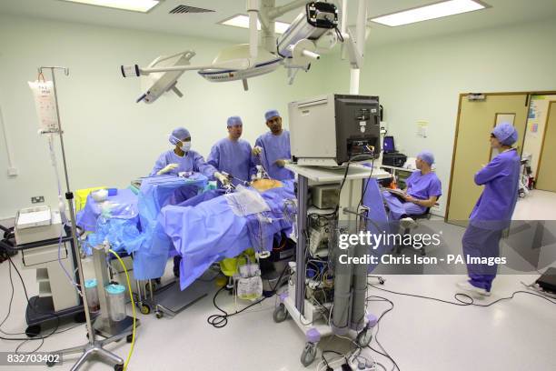 Consultant Surgeon Andrew Miles and Registrar Jim Khan perform a Laparoscopic Anterior Resection on a patient at the Royal Hampshire County Hospital...