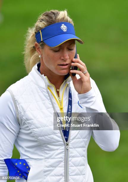 Suzann Pettersen of Team Europe talks on he phone during practice for The Solheim Cup at the Des Moines Country Club on August 16, 2017 in West Des...