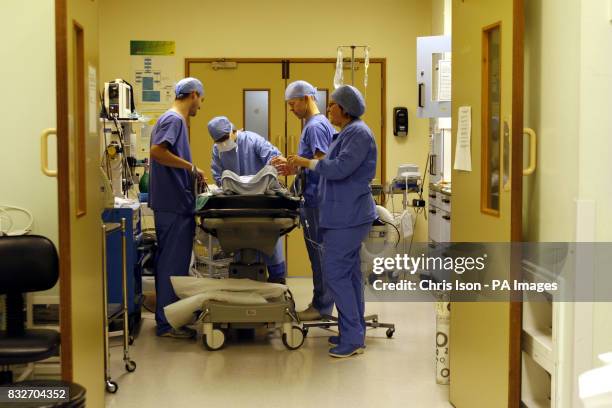 Operating Theatre staff prepare a patient for a Laparoscopic Anterior Resection at the Royal Hampshire County Hospital in Winchester, Hampshire.