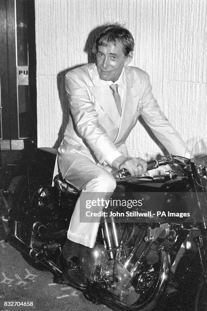 Actor Peter O'Toole sits astride the Brough Superior SS100 motorcycle on which T.E Lawrence met his death in 1935. The actor's arrival at the Odean...