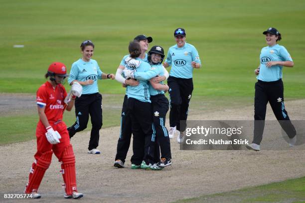 Surrey Stars players celebrate after winning the Kia Super League 2017 match between Lancashire Thunder and Surrey Stars at Old Trafford on August...