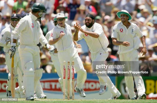 Monty Panesar of England celebrates after bowling Justin Langer of Australia for 37 during the 3rd Test match between Australia and England at the...