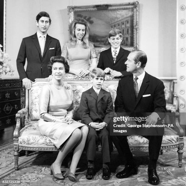 Queen Elizabeth II and the Duke of Edinburgh pose with their children for a Silver Wedding day group in the Belgian suite at Buckingham Palace. Left...