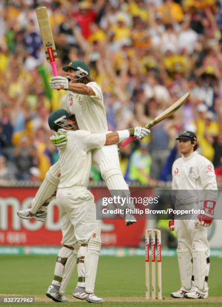 Australian batsman Andrew Symonds celebrates reaching his century during his innings of 156 with batting partner Matthew Hayden during the 4th Test...