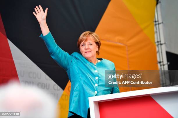German Chancellor Angela Merkel waves as she arrives to address an election campaign rally of the Christian Democratic Union in Heilbronn, southern...