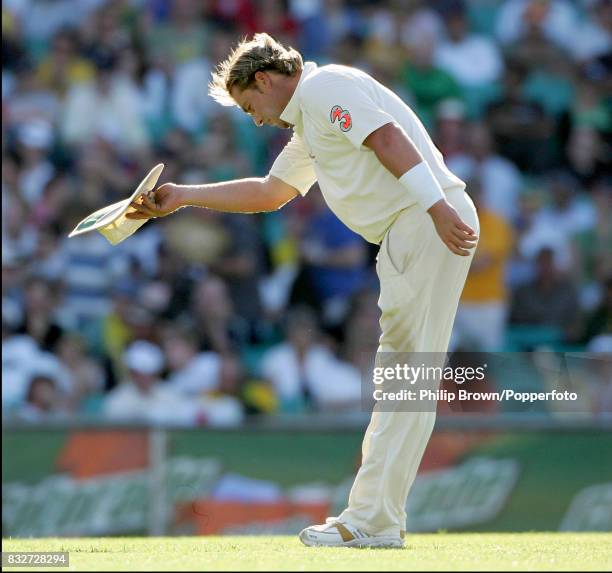 Shane Warne of Australia bows to the crowd after appreciation of the wicket of England's Andrew Flintoff during the 5th Test match between Australia...