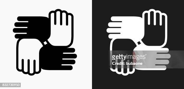 hands united icon on black and white vector backgrounds - ethnicity stock illustrations