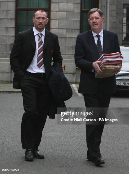 Irish rugby star Trevor Brennan and his legal advisor leave Dublin High Court after securing a temporary injunction against European Rugby Club...