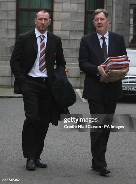 Irish rugby star Trevor Brennan and his legal advisor leave Dublin High Court after securing a temporary injunction against European Rugby Club...