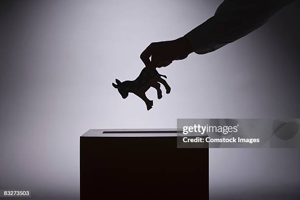 person putting political symbol in box - ballot box bildbanksfoton och bilder