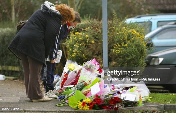 Well-wishers read cards amongst floral tributes at the West Totton Centre in Totton, near Southampton, where 15-year-old schoolboy Dale Little was...