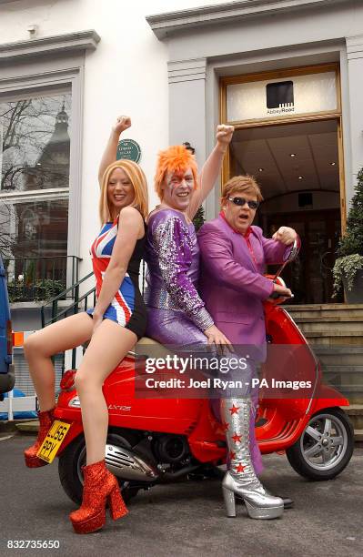 Sitting on a Vespa LX125 scooter Elton John, David Bowie and Geri Halliwell lookalikes launch the England Rocks! campaign to encourage British...