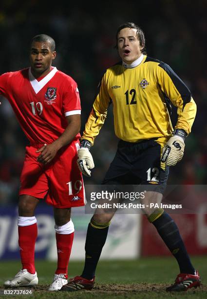 Northern Ireland's Mike Ingham is closley guarded by Wales' Jermaine Easter