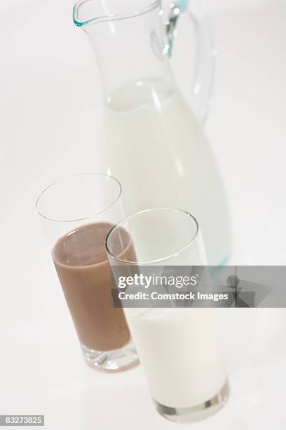 glasses of milk and pitcher - milk pitcher ストックフォトと画像