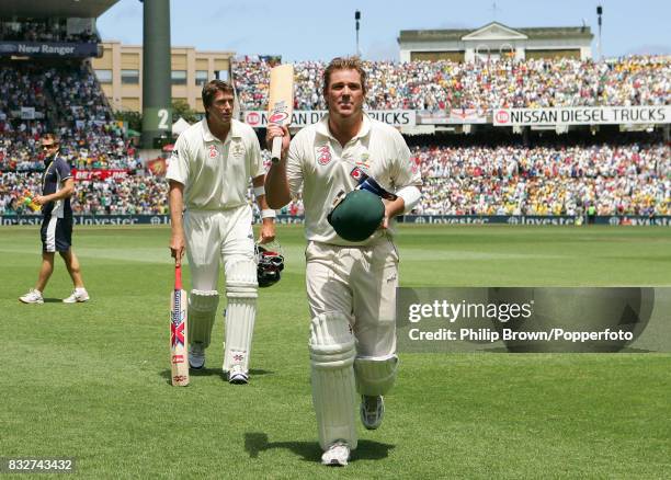 Retiring Australian cricketers Shane Warne, left, and Glenn McGrath leave the field together after Shane Warne was dismissed on 71 to end the...