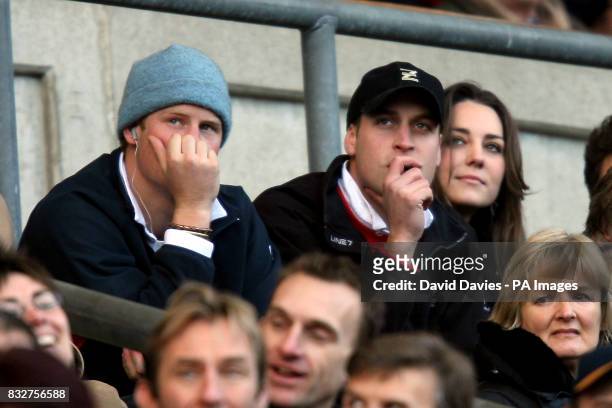 Prince's Harry and William watch the action from the stands with Williams girlfriend Kate Middleton