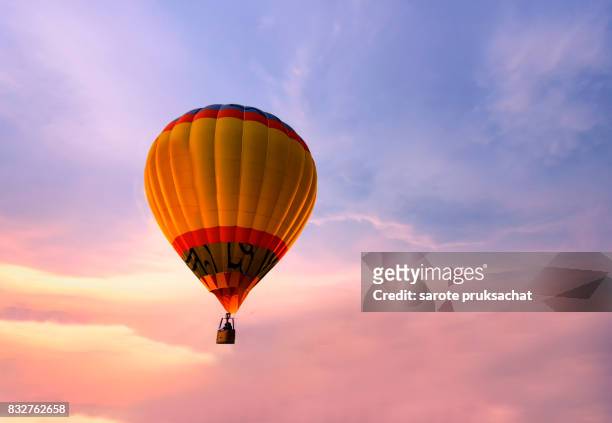 colorful hot air balloon on sunset sky. - hot air balloon ride stock-fotos und bilder
