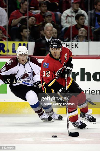 Jarome Iginla of the Calgary Flames skates against Tyler Arnason of the Colorado Avalanche on October 14, 2008 at Pengrowth Saddledome in Calgary,...