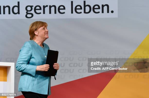 German Chancellor Angela Merkel smiles after addressing an election campaign rally of the Christian Democratic Union in Heilbronn, southern Germany...