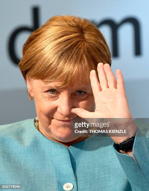 German Chancellor Angela Merkel waves during an election campaign rally of the Christian Democratic Union in Heilbronn, southern Germany on August...