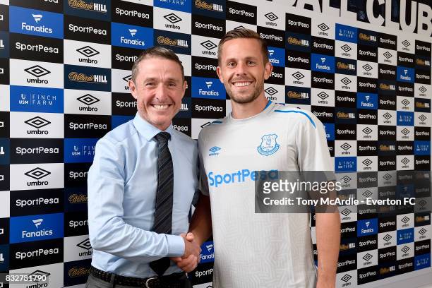 New Everton signing Gylfi Sigurdsson poses for a photo with Robert Elstone at USM Finch Farm on August 16, 2017 in Halewood, England.