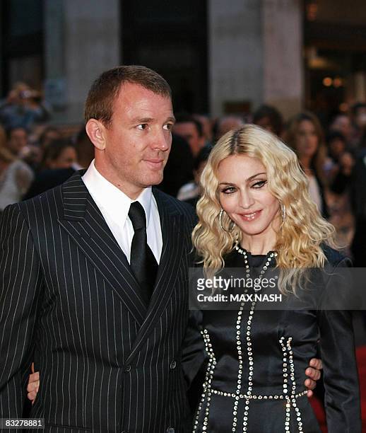 This file picture taken on September 1, 2008 in London shows US singer Madonna arriving with her husband British film director Guy Ritchie for the...