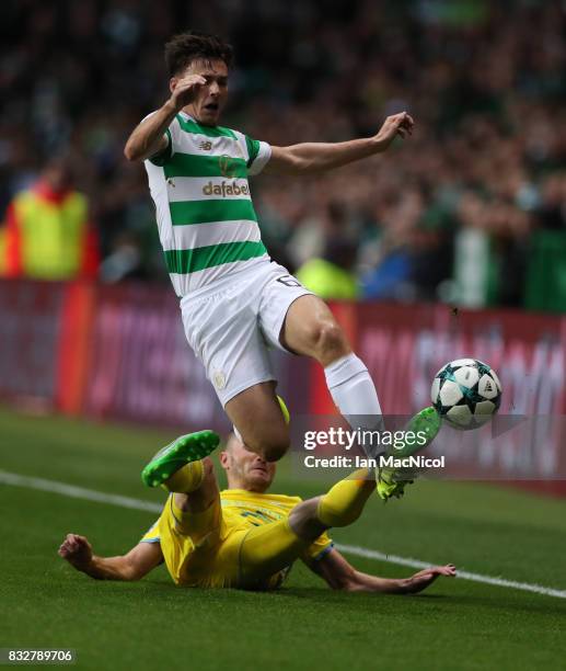 Igor Shitov of FC Astana vies with Kieran Tierney of Celtic during the UEFA Champions League Qualifying Play-Offs Round First Leg match between...