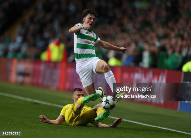 Igor Shitov of FC Astana vies with Kieran Tierney of Celtic during the UEFA Champions League Qualifying Play-Offs Round First Leg match between...