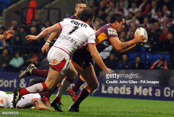 Brisbane Broncos' Corey Parker scores a try against St Helens during the Carnegie World Cup Challenge at the Reebok Stadium, Bolton.