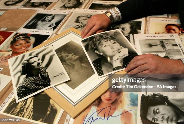 Collector Alan Robinson arranges signed photographs of Grace Kelly, Greta Garbo and Helen Mirren, some of his most valuable autographed photographs...