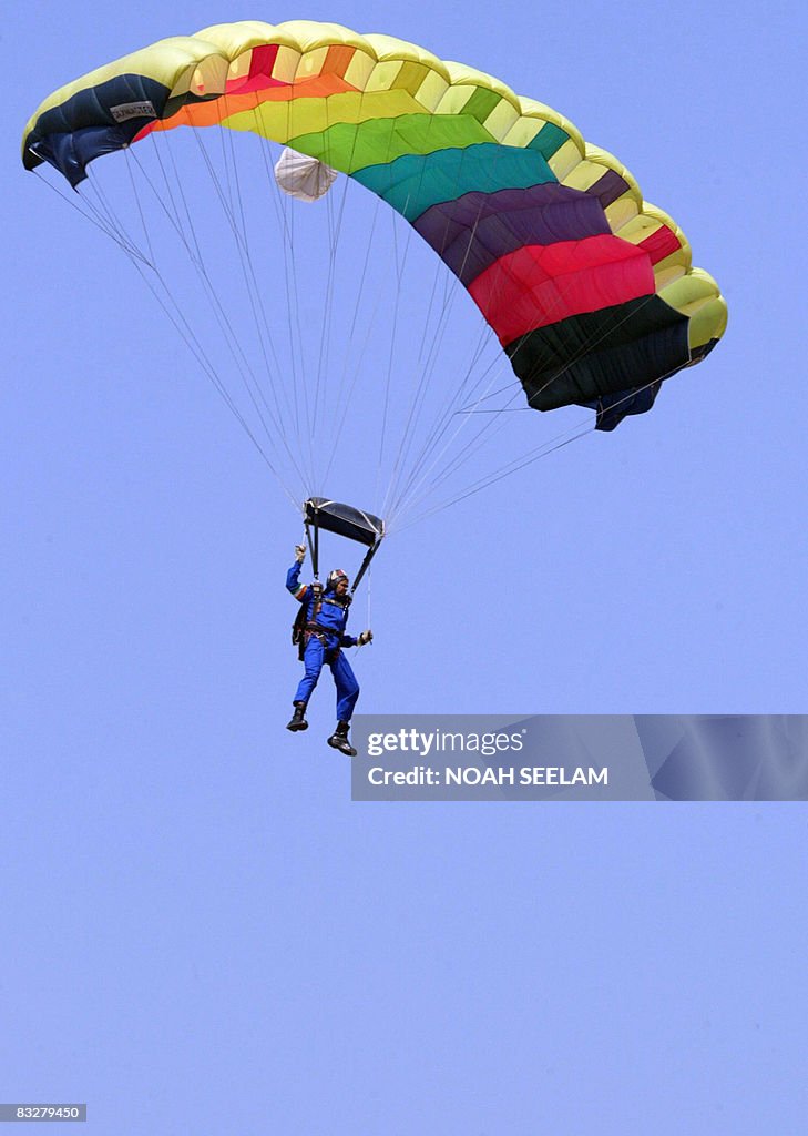 An Indian Air Force parachutist floats d