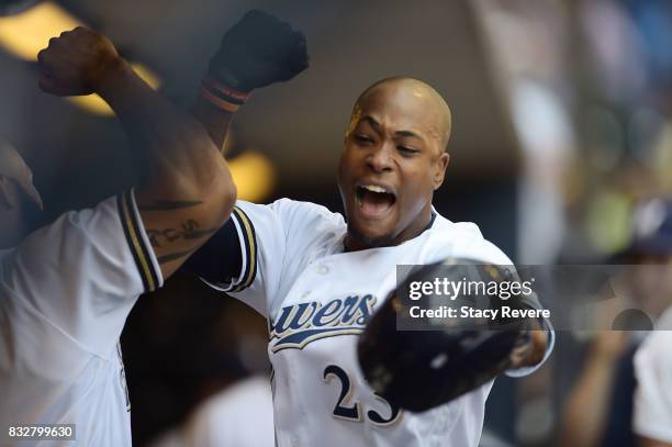 Keon Broxton of the Milwaukee Brewers is congratulated by teammates following a solo home run during the third inning of a game against the...