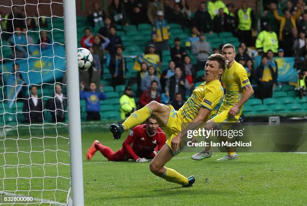 Evgeni Postnikov of FC Astana scores an own goal during the UEFA Champions League Qualifying Play-Offs Round First Leg match between Celtic FC and FK...