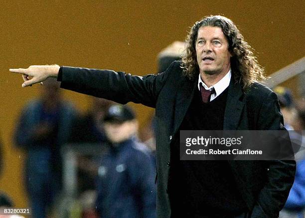 Qatari coach Bruno Metsu gives his players instructions during the 2010 FIFA World Cup qualifier match between the Australian Socceroos and Qatar at...