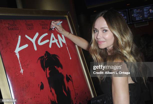 Actress Vanessa Angel signs the poster at the Premiere Of Parade Deck’s “Lycan” held at Laemmle's Ahrya Fine Arts Theatre on August 15, 2017 in...