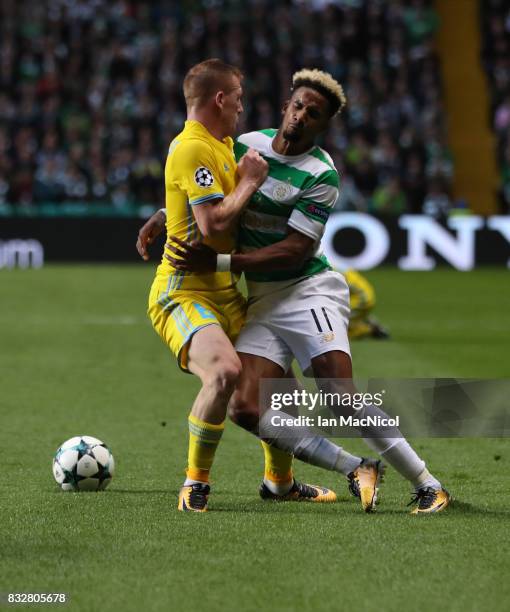 Scott Sinclair of Celtic vies with Laszlo Kleinheisler of FC Astana during the UEFA Champions League Qualifying Play-Offs Round First Leg match...